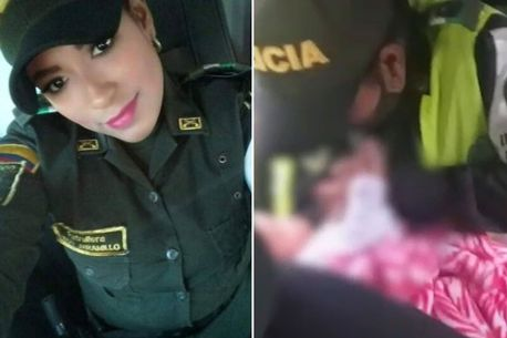Oficerja e policisë i jep gji foshnjes së marrë peng, para kthimit te prindërit